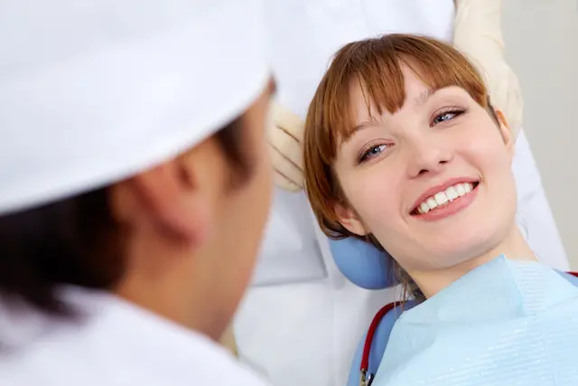 woman smiling at doctor
